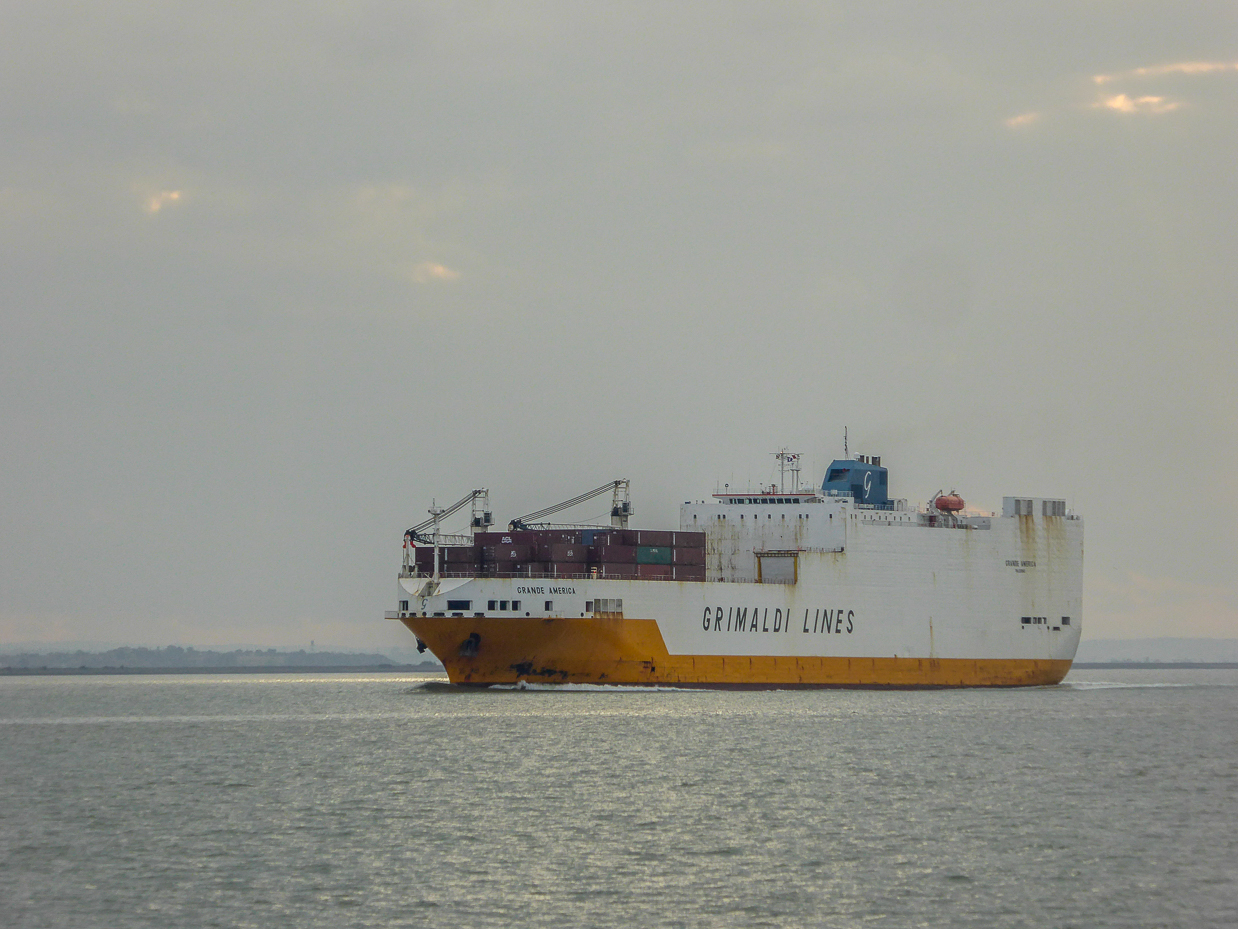 Container ship heading out to open sea